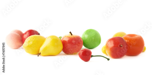 Pile of multiple artificial plastic fruits and berries