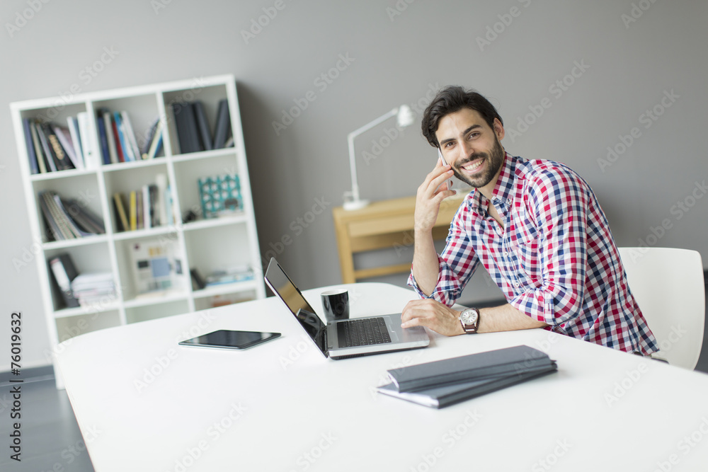 Young man in the office Young man in the office