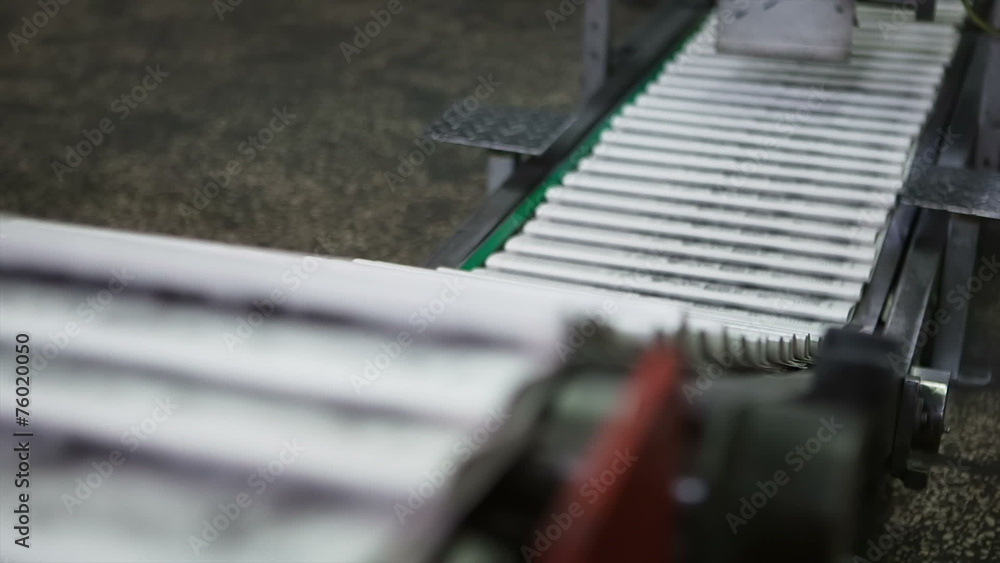 Ready newspaper on production line Ready newspaper on production line