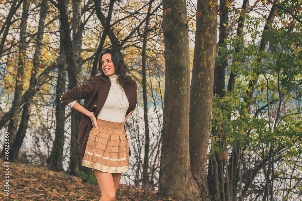 Beautiful young woman posing in a city park Beautiful young woman posing in a city park