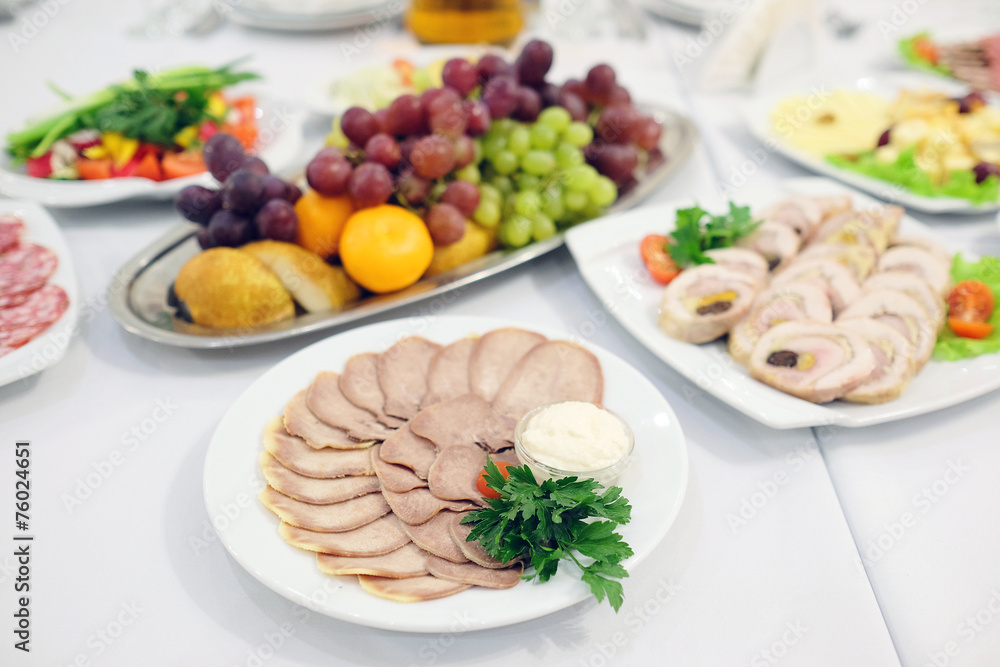 The image of the dishes and food on the served table The image of the dishes and food on the served table