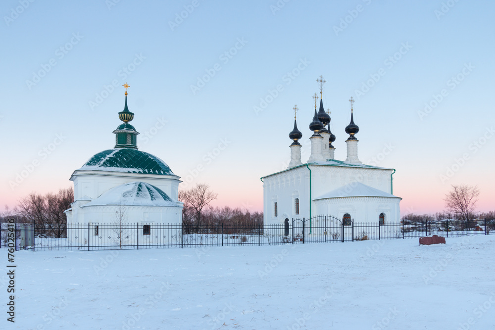 Winter landscape in frosty morning with old orthodox church