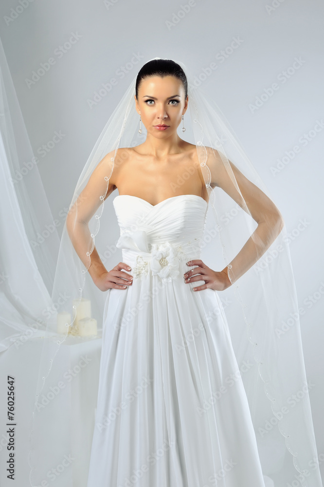 Slim beautiful woman wearing luxurious wedding dress Slim beautiful woman wearing luxurious wedding dress