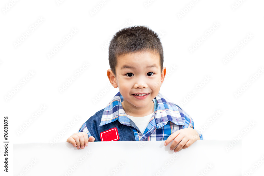 Portrait of happy little boy standing and holding empty white bo Portrait of happy little boy standing and holding empty white bo