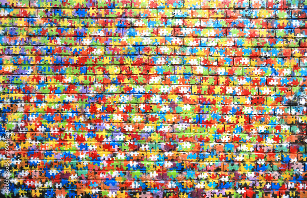 Naklejka premium Kolor tła graffiti ulicznych na ścianie z cegły