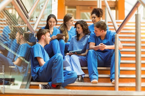 Obraz na płótnie Medical students taking a break on the steps