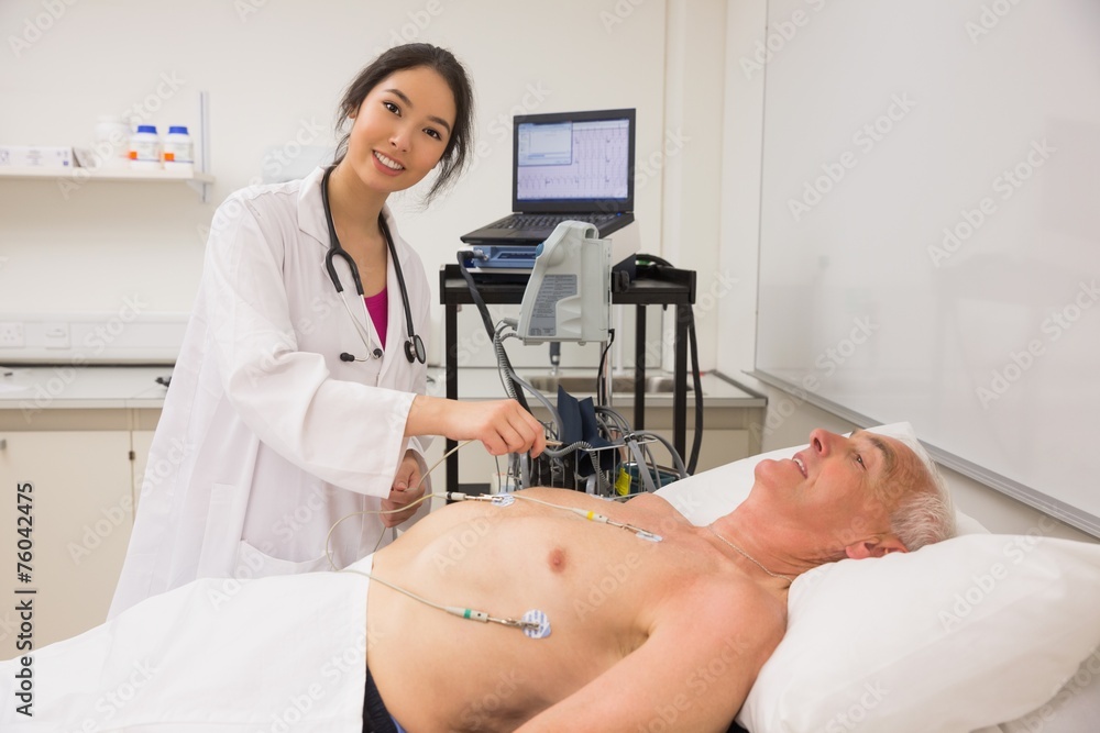 Medical student practicing on older man