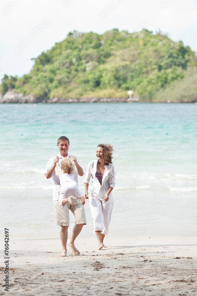 Happy Family Having Fun on Beautiful Sunny Beach Happy Family Having Fun on Beautiful Sunny Beach