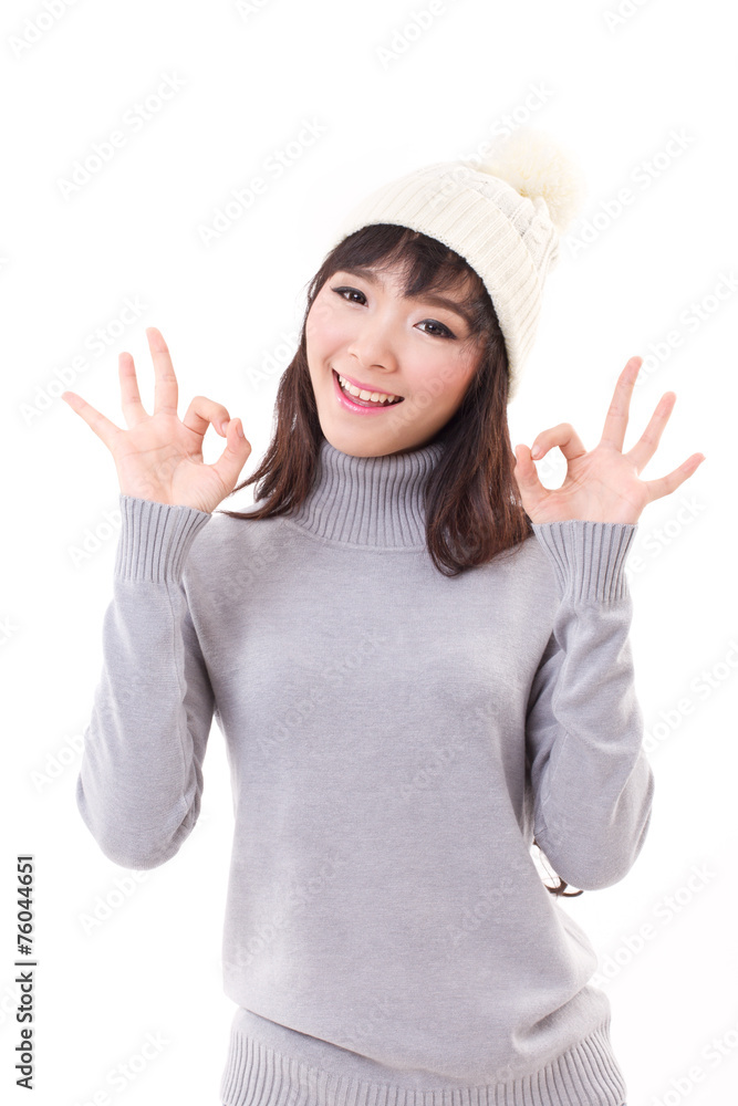 happy woman giving ok hand sign, fall or winter dress happy woman giving ok hand sign, fall or winter dress