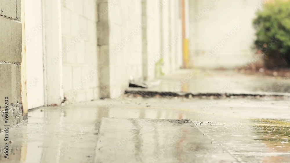 Concrete wall getting wet by the rain on a rainy day. Concrete wall getting wet by the rain on a rainy day.