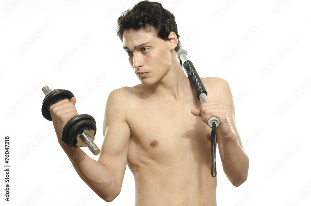 Skinny man training bicep muscle. Teenager lifting a dumbbell Skinny man training bicep muscle. Teenager lifting a dumbbell