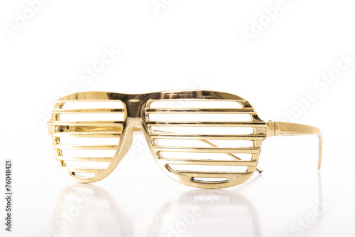 Gold glasses on white background