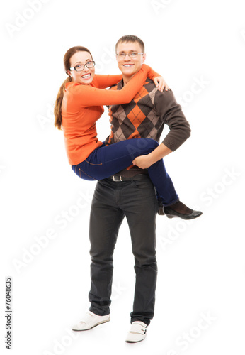 Happy Caucasian couple relaxing together on white