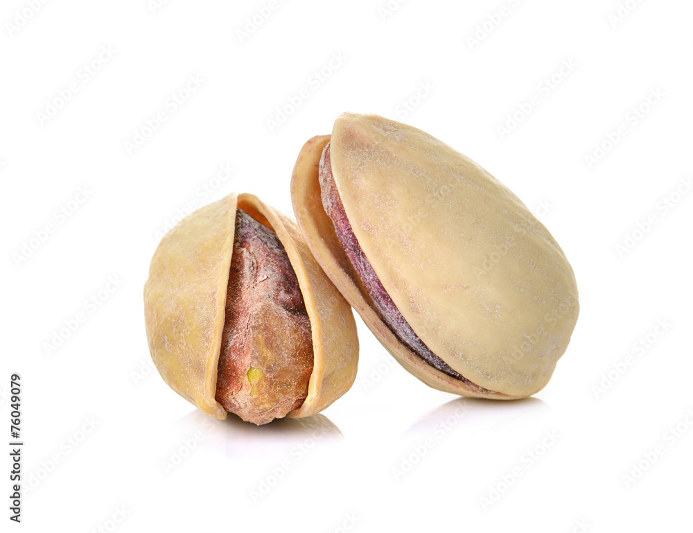 toasted pistachios on a white background toasted pistachios on a white background