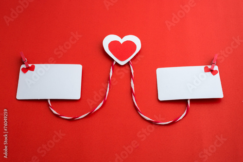 valentine's paper hearts with a blank business card and Clothesp photo