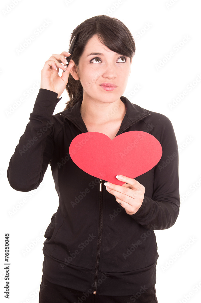 beautiful young latin happy girl holding red paper heart and a pen beautiful young latin happy girl holding red paper heart and a pen