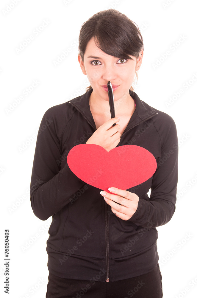 beautiful young latin happy girl holding red paper heart and a pen beautiful young latin happy girl holding red paper heart and a pen