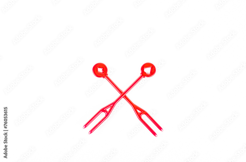 red plastic food skewer on white background red plastic food skewer on white background