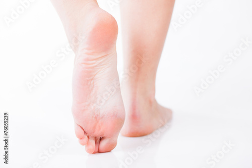 Beautiful well-groomed women's feet walking