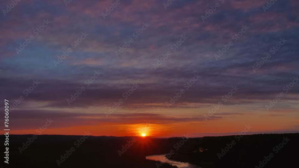 The cloudy sunset (sunrise) above land with lake (pond) The cloudy sunset (sunrise) above land with lake (pond)