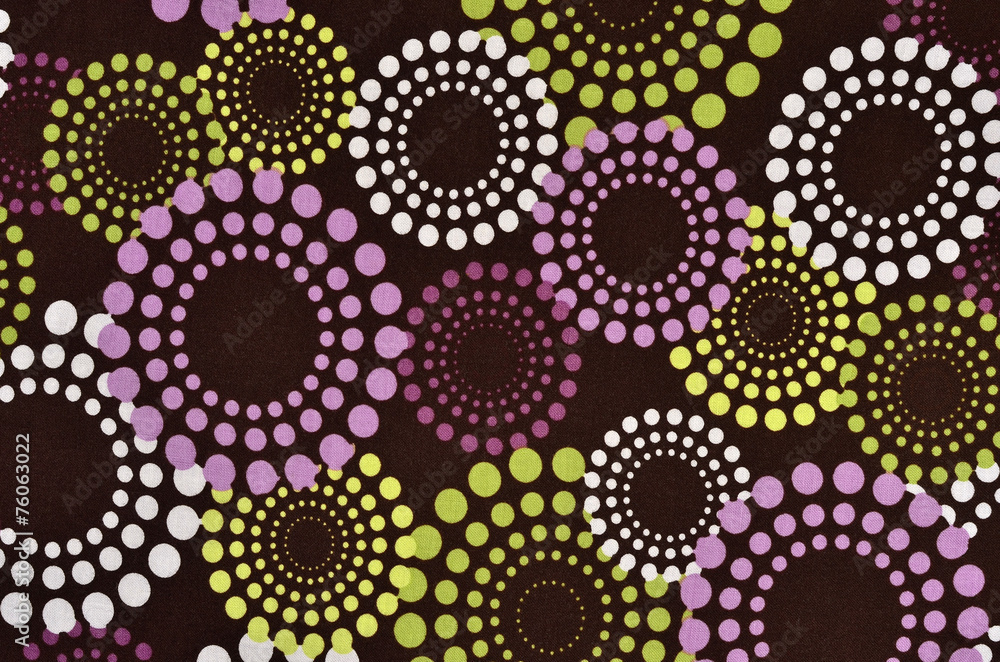 Purple, green polka dots circles pattern on dark background.