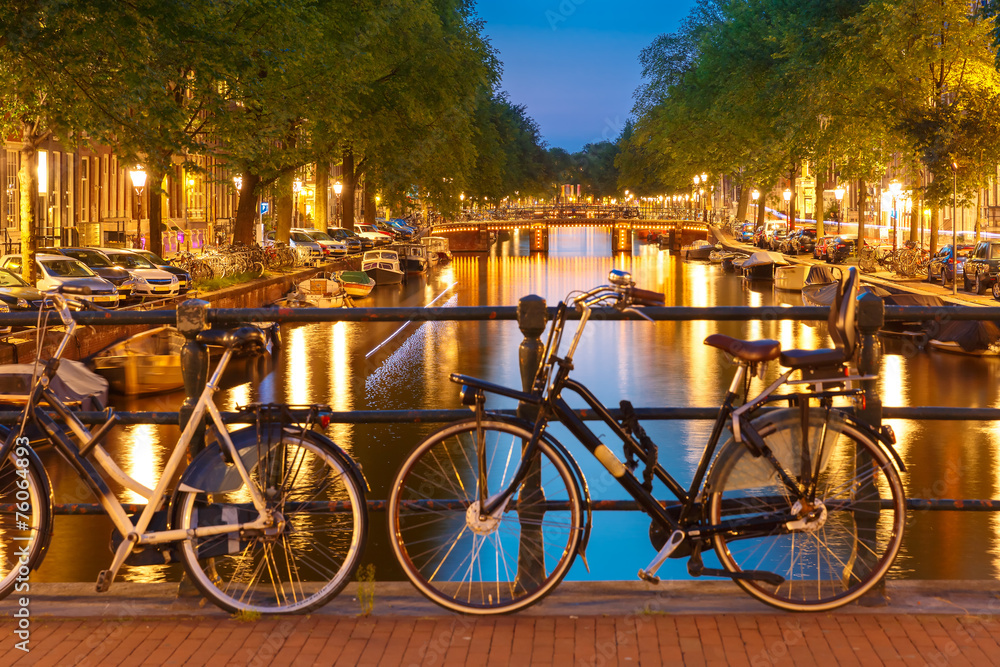 Night  illumination of Amsterdam canal and bridge