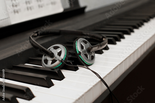 Headphones lying on the piano keys