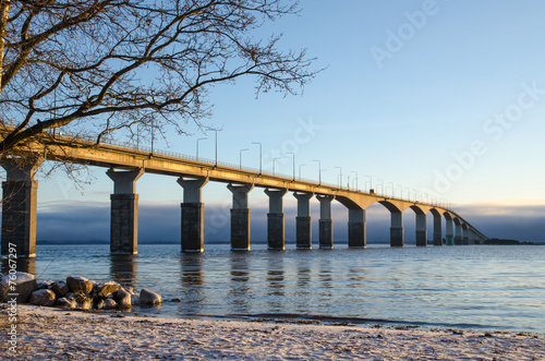 Winter beach by the bridge