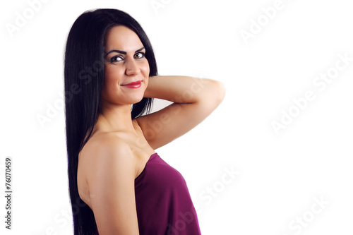 Beautiful young woman with long black hair. Pretty model posing