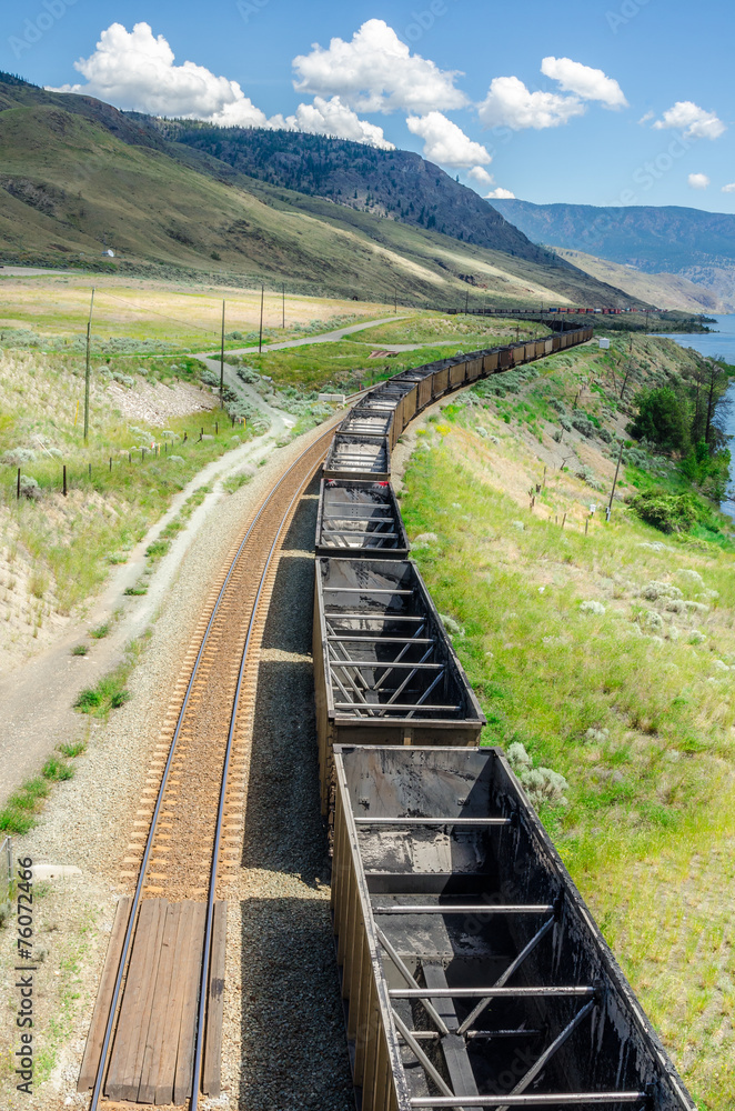 Empty Cargo Train on a Mountainous Region Empty Cargo Train on a Mountainous Region