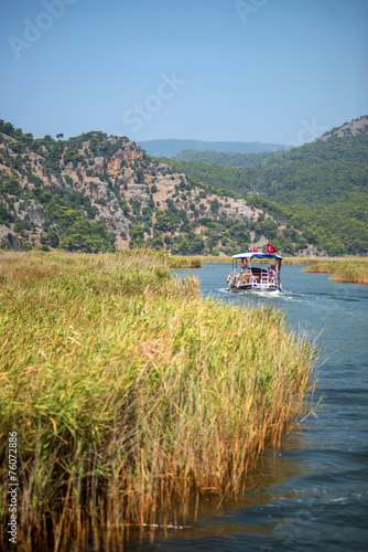 TURKEY, DALYAN, MUGLA - JULY 19, 2014: Touristic River Boats wit