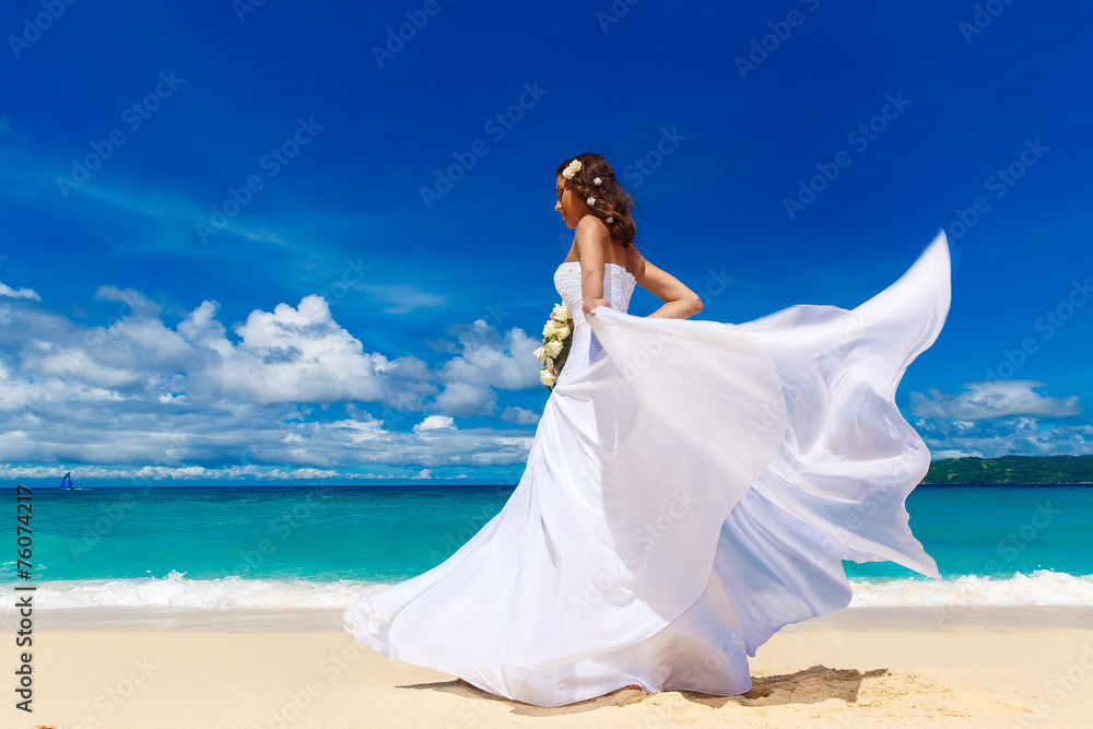 Beautiful brunette bride in white wedding dress with big long wh Beautiful brunette bride in white wedding dress with big long wh