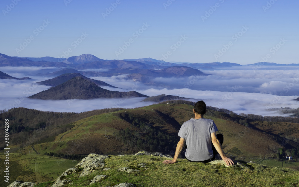 Fototapeta premium Man enjoying the landscape, Basque country.