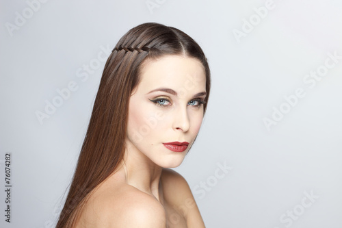  Portrait of beautiful young woman on white 