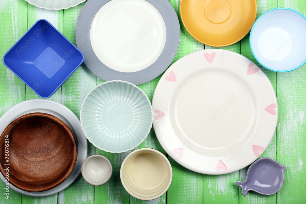 Different tableware on wooden background Different tableware on wooden background