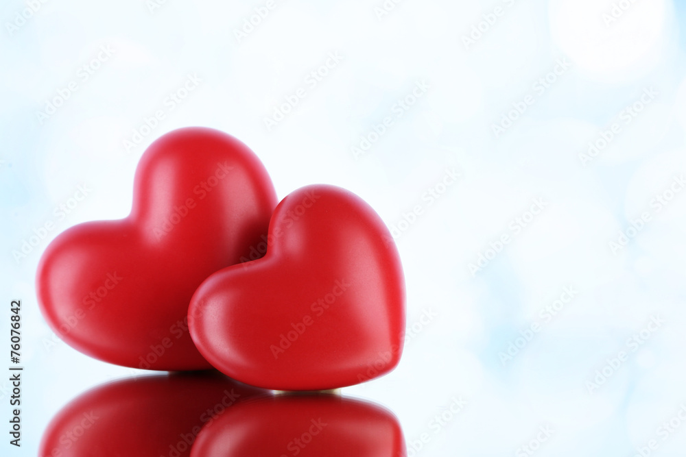 Red hearts on light background Red hearts on light background