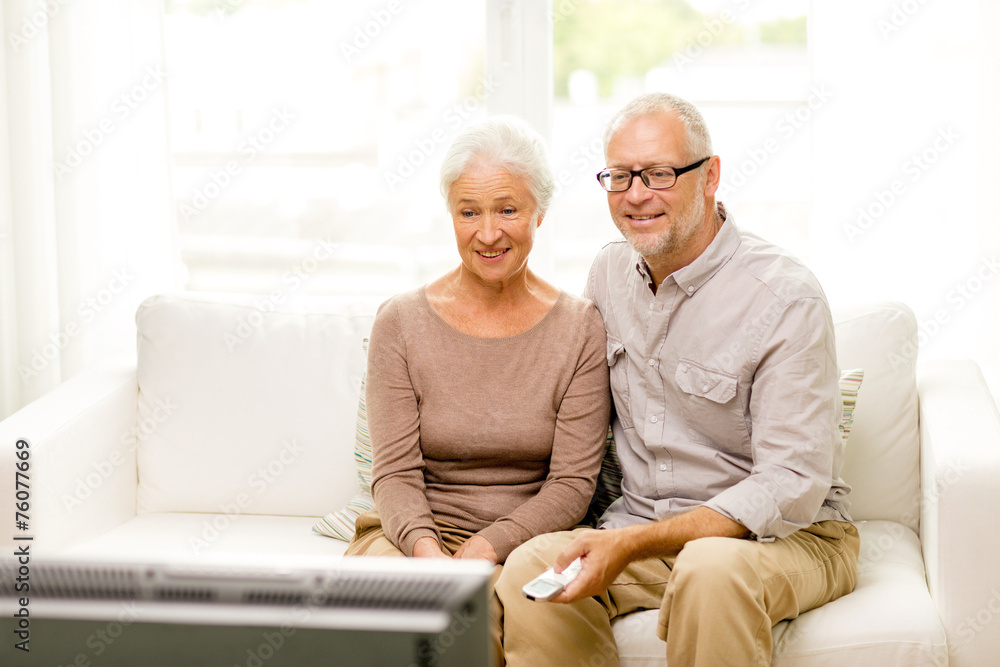happy senior couple watching tv at home happy senior couple watching tv at home