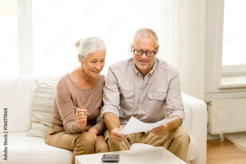 senior couple with papers and calculator at home senior couple with papers and calculator at home