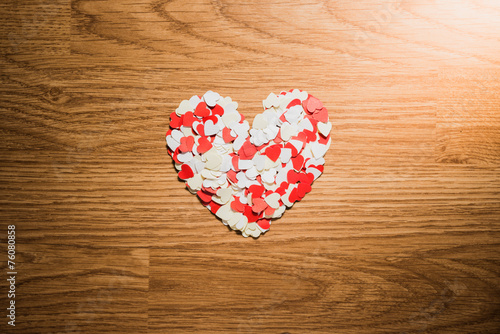 many red and white heart on a wooden background