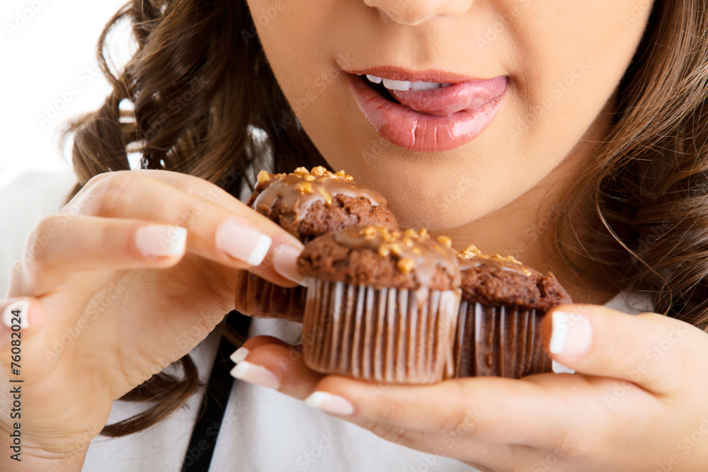 Young woman with chocolate muffin Young woman with chocolate muffin