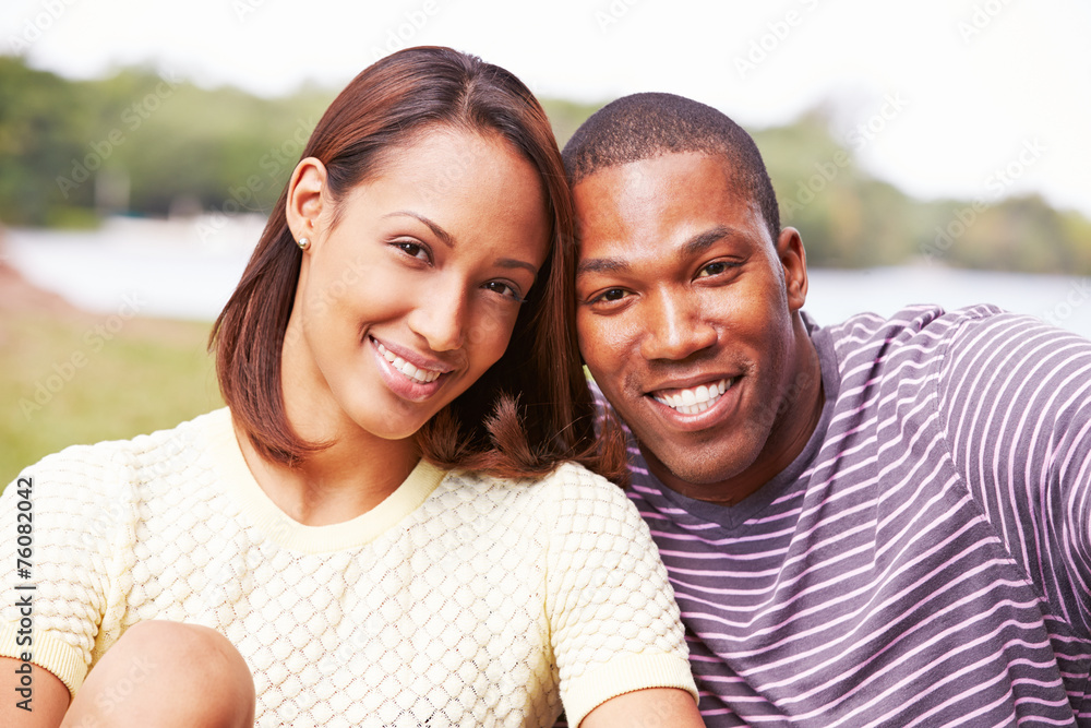 Fototapeta premium Portrait Of Happy Young Couple In Garden