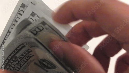 counting a lot of one hundred dollar bills