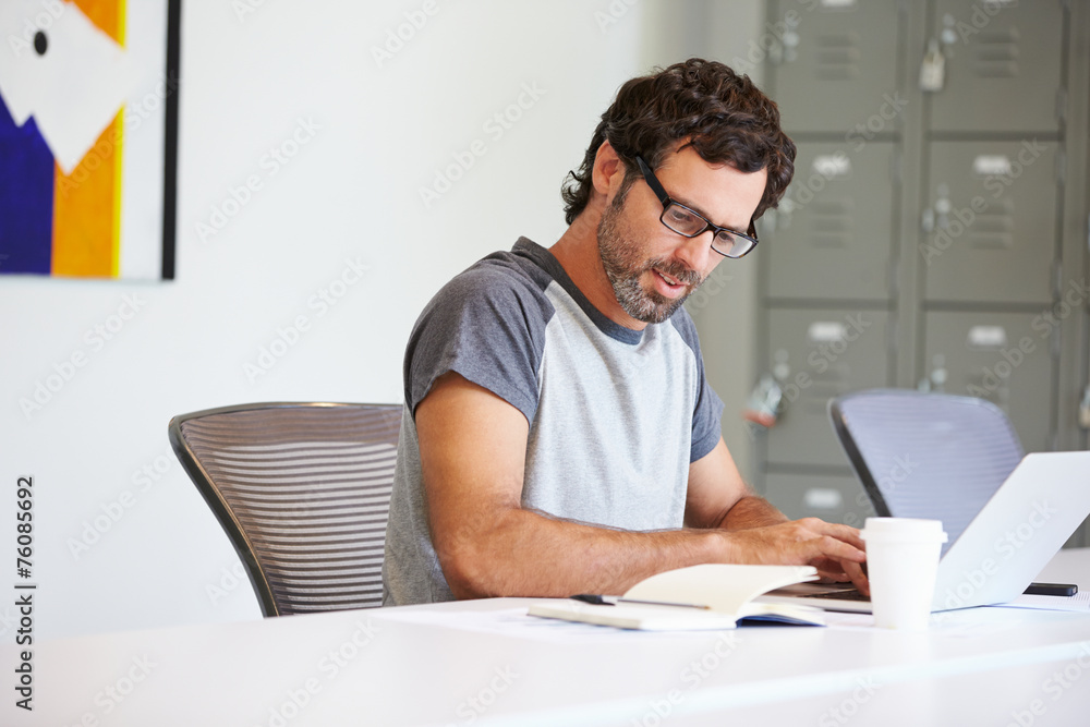 Casually Dressed Man Working In Design Studio Casually Dressed Man Working In Design Studio