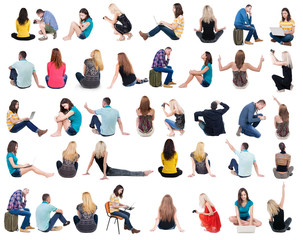 Collection back view of sitting people.