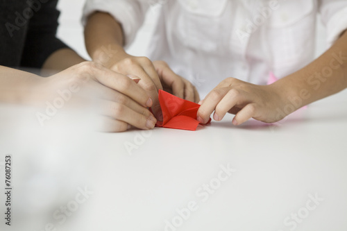 Parent-child playing with origami