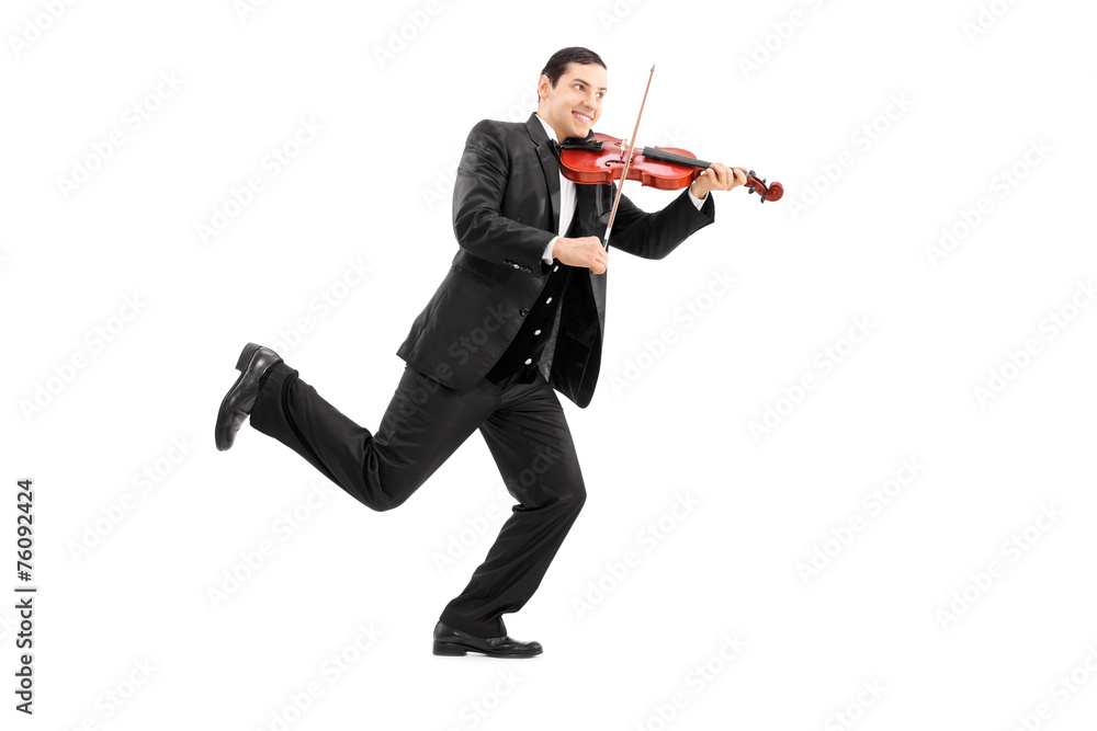 Man running and playing a violin Man running and playing a violin