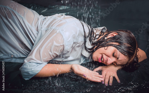 Portrait of the girl under drops