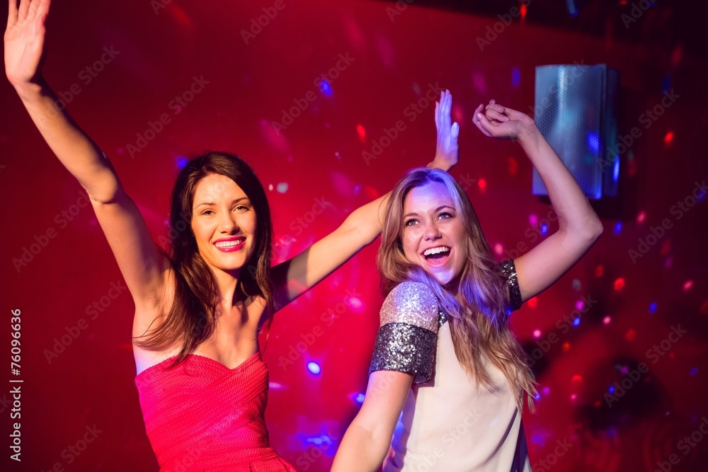 Pretty friends dancing and smiling Pretty friends dancing and smiling