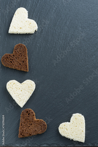 Wallpaper Mural dark background with toasted rye and white bread in heart shape Torontodigital.ca