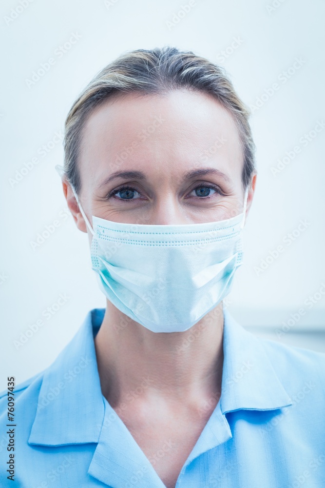 Female dentist wearing surgical mask Female dentist wearing surgical mask